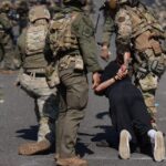 „Nácvik občianskej vojny“: rasové nepokoje rozdelili krajinu