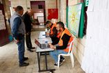 Na Západnom brehu a v časti Pásma Gazy otvorili volebné miestnosti napriek rozkolu frakcií